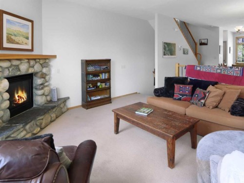 36-300 Eagle Terrace Road, Canmore, AB - Indoor Photo Showing Living Room With Fireplace