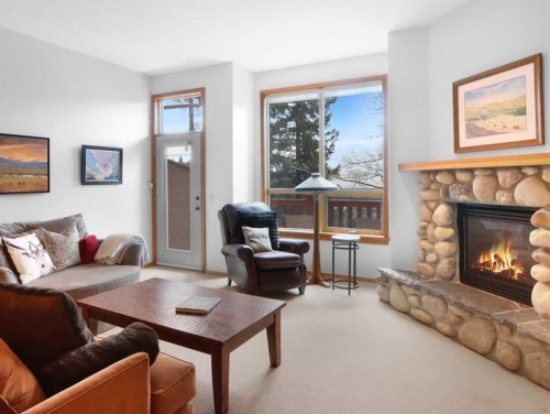 36-300 Eagle Terrace Road, Canmore, AB - Indoor Photo Showing Living Room With Fireplace