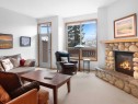 36-300 Eagle Terrace Road, Canmore, AB  - Indoor Photo Showing Living Room With Fireplace 
