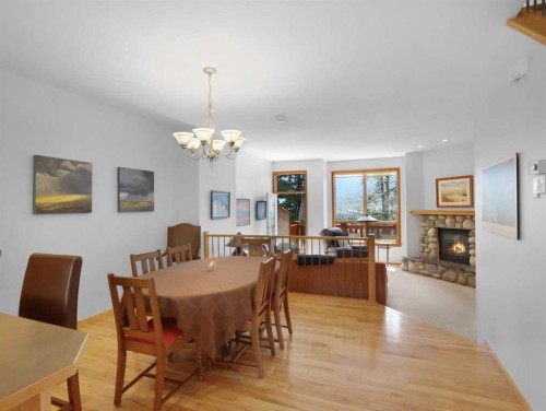 36-300 Eagle Terrace Road, Canmore, AB - Indoor Photo Showing Dining Room With Fireplace