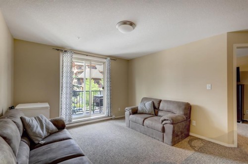 202-186 Kananaskis Way, Canmore, AB - Indoor Photo Showing Living Room
