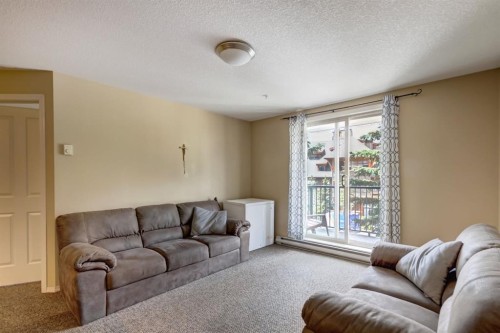 202-186 Kananaskis Way, Canmore, AB - Indoor Photo Showing Living Room