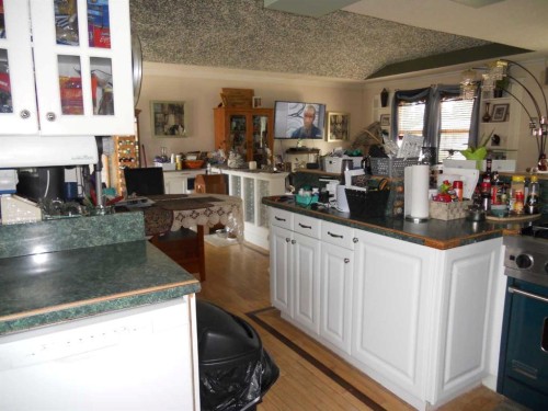 710 3 Avenue, Fox Creek, AB - Indoor Photo Showing Kitchen With Fireplace