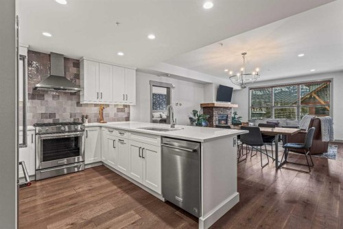 302-1105 Spring Creek Drive, Canmore, AB - Indoor Photo Showing Kitchen With Upgraded Kitchen