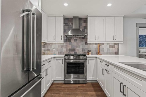 302-1105 Spring Creek Drive, Canmore, AB - Indoor Photo Showing Kitchen With Stainless Steel Kitchen With Upgraded Kitchen