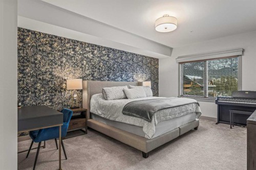302-1105 Spring Creek Drive, Canmore, AB - Indoor Photo Showing Bedroom