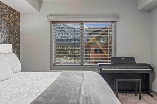 302-1105 Spring Creek Drive, Canmore, AB - Indoor Photo Showing Bedroom