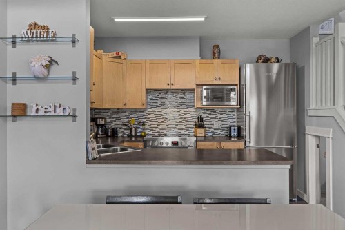 321-107 Montane Road, Canmore, AB - Indoor Photo Showing Kitchen With Double Sink