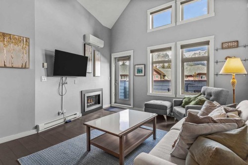 321-107 Montane Road, Canmore, AB - Indoor Photo Showing Living Room With Fireplace