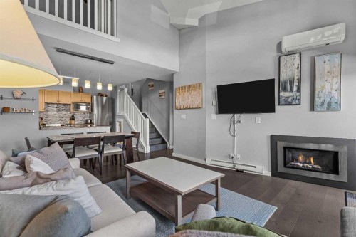 321-107 Montane Road, Canmore, AB - Indoor Photo Showing Living Room With Fireplace