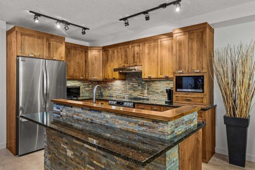 218-106 Stewart Creek Landing, Canmore, AB 