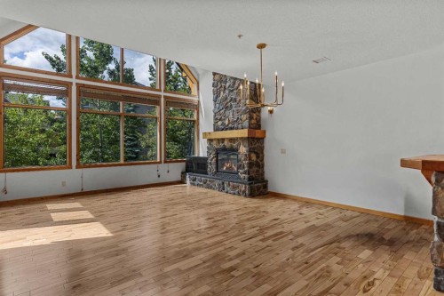 202-75 Dyrgas Gate, Canmore, AB - Indoor With Fireplace