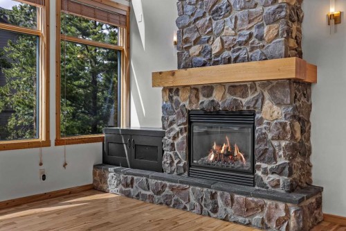 202-75 Dyrgas Gate, Canmore, AB - Indoor Photo Showing Living Room With Fireplace