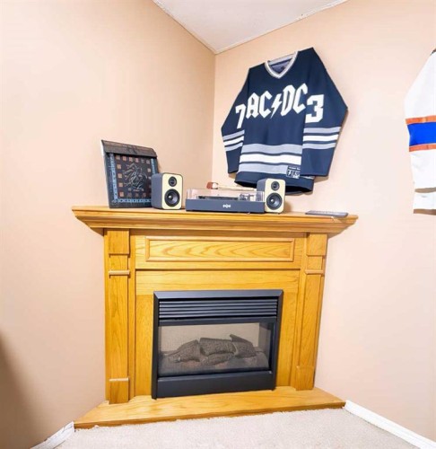 1109 56 Street, Edson, AB - Indoor Photo Showing Living Room With Fireplace