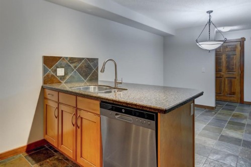 111-170 Crossbow Place, Canmore, AB - Indoor Photo Showing Kitchen With Double Sink