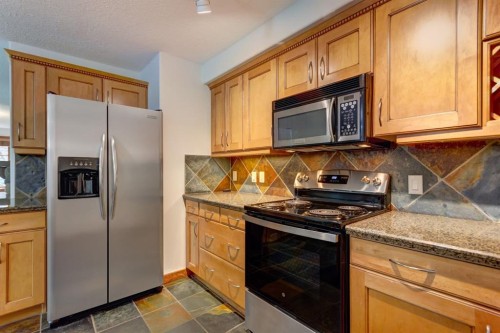 111-170 Crossbow Place, Canmore, AB - Indoor Photo Showing Kitchen
