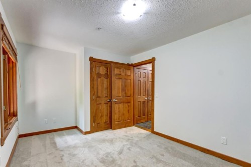 111-170 Crossbow Place, Canmore, AB - Indoor Photo Showing Other Room