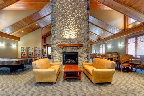 111-170 Crossbow Place, Canmore, AB - Indoor Photo Showing Other Room With Fireplace