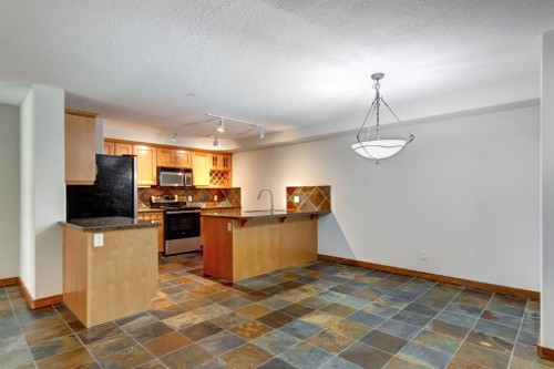 111-170 Crossbow Place, Canmore, AB - Indoor Photo Showing Kitchen
