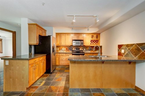 111-170 Crossbow Place, Canmore, AB - Indoor Photo Showing Kitchen