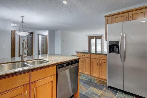 111-170 Crossbow Place, Canmore, AB - Indoor Photo Showing Kitchen With Double Sink