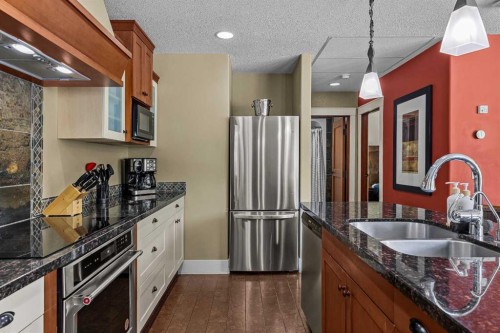 103-191 Kananaskis Way, Canmore, AB - Indoor Photo Showing Kitchen With Double Sink With Upgraded Kitchen