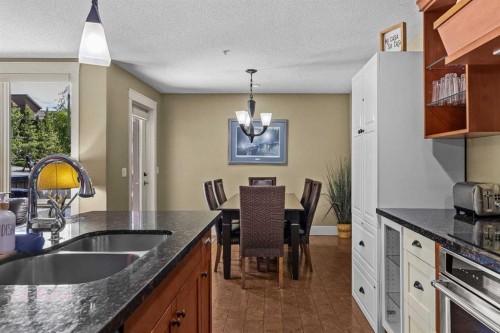 103-191 Kananaskis Way, Canmore, AB - Indoor Photo Showing Kitchen With Double Sink