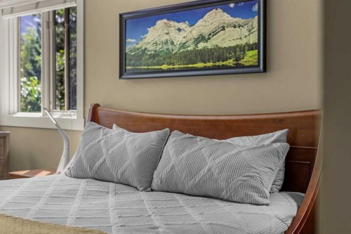 103-191 Kananaskis Way, Canmore, AB - Indoor Photo Showing Bedroom