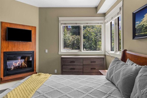 103-191 Kananaskis Way, Canmore, AB - Indoor With Fireplace