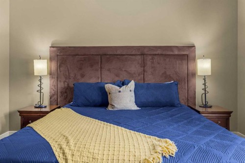 103-191 Kananaskis Way, Canmore, AB - Indoor Photo Showing Bedroom
