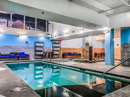103-191 Kananaskis Way, Canmore, AB - Indoor Photo Showing Other Room With In Ground Pool