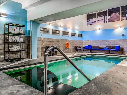 103-191 Kananaskis Way, Canmore, AB - Indoor Photo Showing Other Room With In Ground Pool