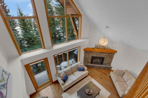 5102-101E Stewart Creek Landing, Canmore, AB - Indoor With Fireplace