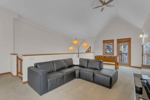 5102-101E Stewart Creek Landing, Canmore, AB - Indoor Photo Showing Living Room