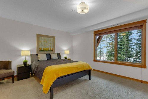 5102-101E Stewart Creek Landing, Canmore, AB - Indoor Photo Showing Bedroom