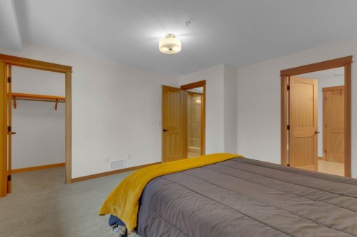 5102-101E Stewart Creek Landing, Canmore, AB - Indoor Photo Showing Bedroom