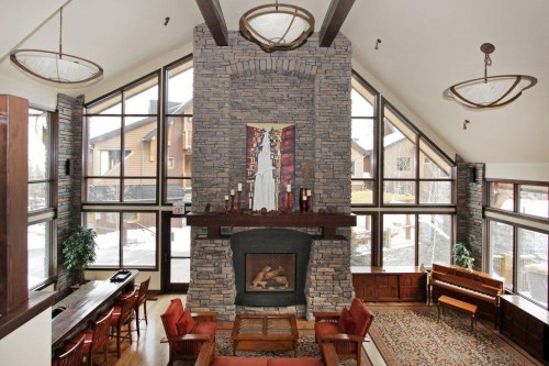 5102-101E Stewart Creek Landing, Canmore, AB - Indoor Photo Showing Other Room With Fireplace