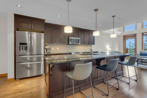 5102-101E Stewart Creek Landing, Canmore, AB - Indoor Photo Showing Kitchen With Double Sink With Upgraded Kitchen