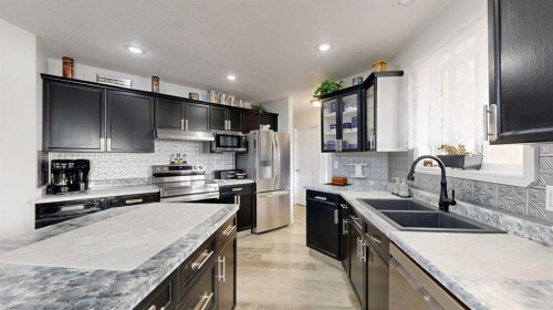 27 Patterson Place, Whitecourt, AB - Indoor Photo Showing Kitchen With Double Sink With Upgraded Kitchen