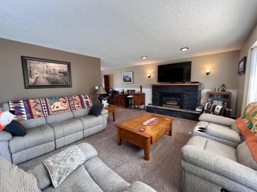 165 Mcpherson Drive, Hinton, AB - Indoor Photo Showing Living Room With Fireplace