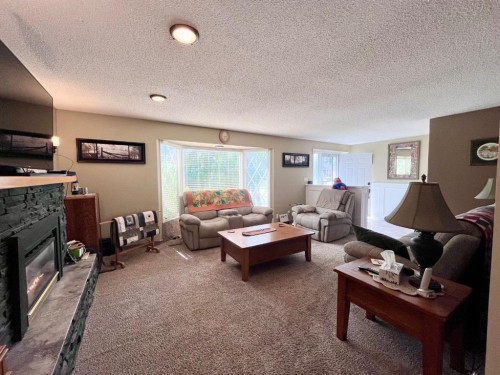165 Mcpherson Drive, Hinton, AB - Indoor Photo Showing Living Room With Fireplace