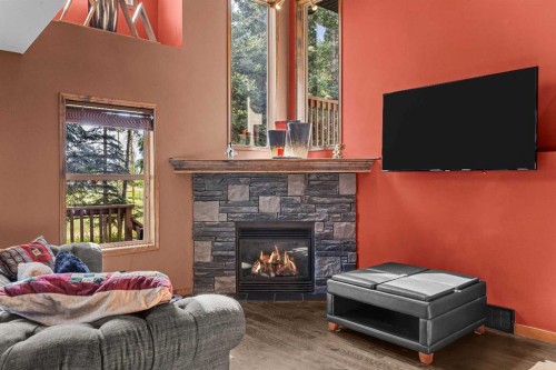 202-108 Armstrong Place, Canmore, AB - Indoor Photo Showing Living Room With Fireplace