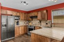202-108 Armstrong Place, Canmore, AB  - Indoor Photo Showing Kitchen With Double Sink 