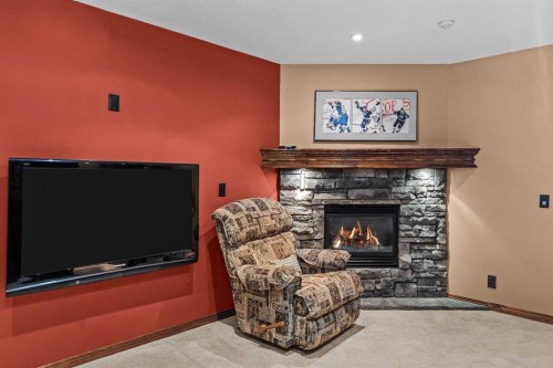 202-108 Armstrong Place, Canmore, AB - Indoor Photo Showing Living Room With Fireplace