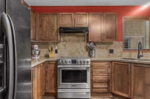 202-108 Armstrong Place, Canmore, AB - Indoor Photo Showing Kitchen With Double Sink With Upgraded Kitchen