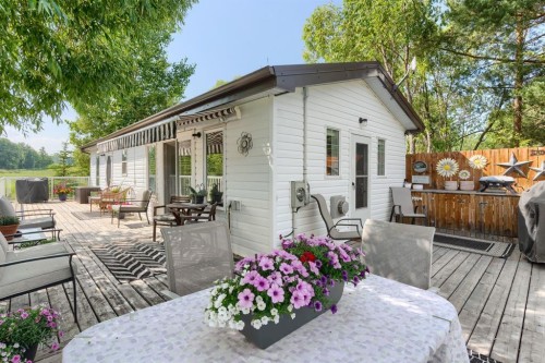 816 Baptiste Drive, West Baptiste, AB - Outdoor With Deck Patio Veranda With Exterior