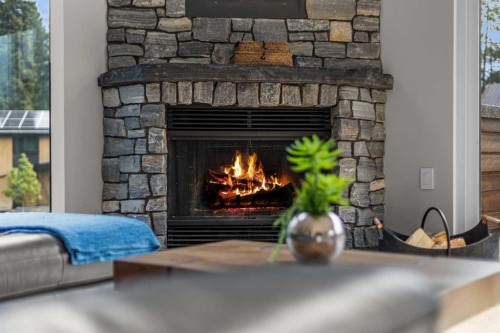 610 Larch Place, Canmore, AB - Indoor Photo Showing Living Room With Fireplace