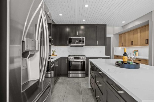 610 Larch Place, Canmore, AB - Indoor Photo Showing Kitchen With Stainless Steel Kitchen With Upgraded Kitchen