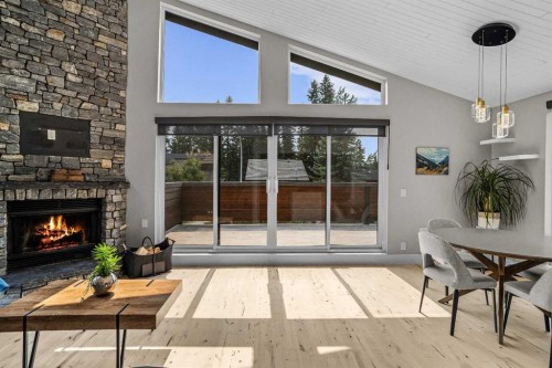 610 Larch Place, Canmore, AB - Indoor Photo Showing Other Room With Fireplace