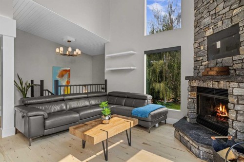 610 Larch Place, Canmore, AB - Indoor Photo Showing Living Room With Fireplace